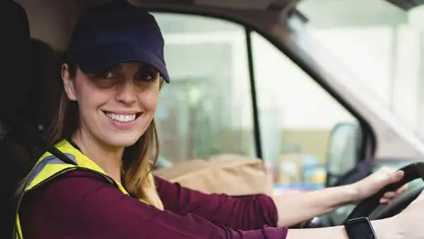 Truck driver lady sitting in truck